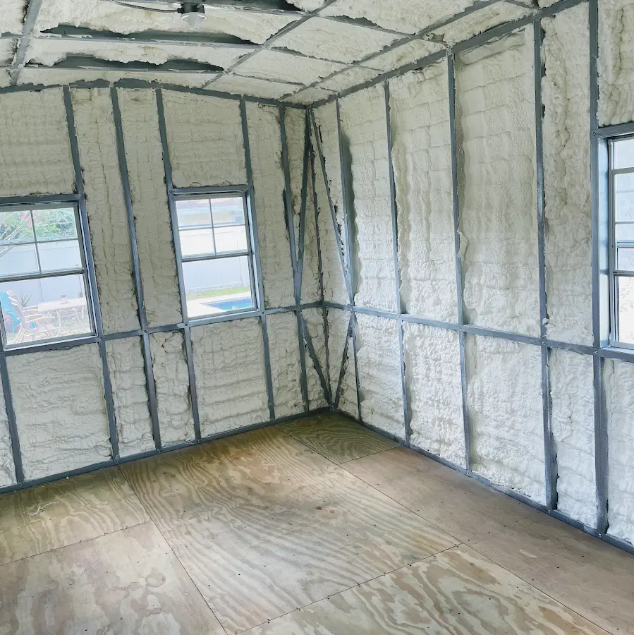 Closed-cell spray foam insulation applied to wall cavities in a residential project in Marshalltown